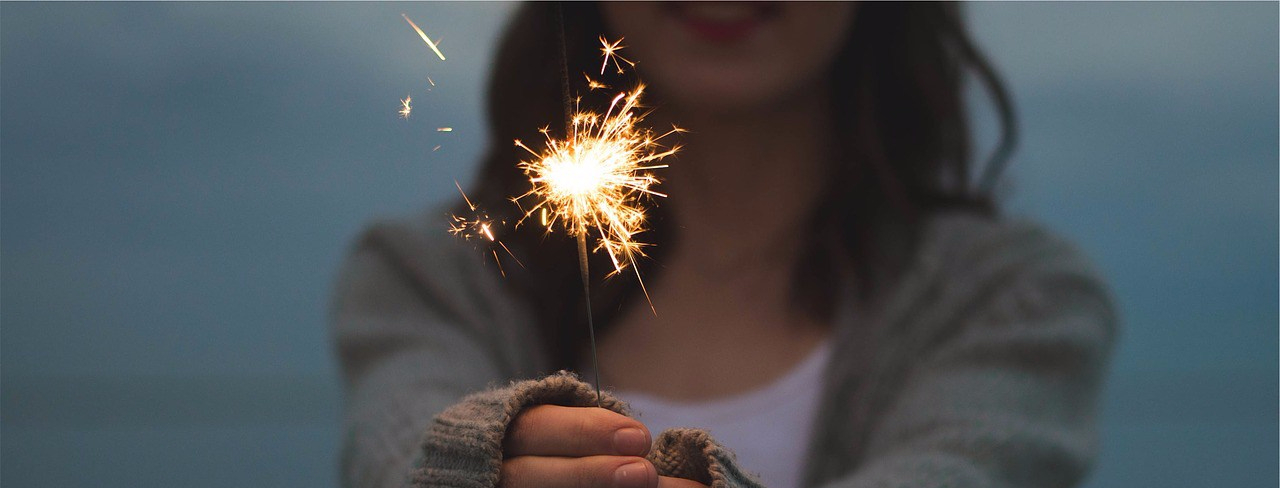 girl holding sparkler