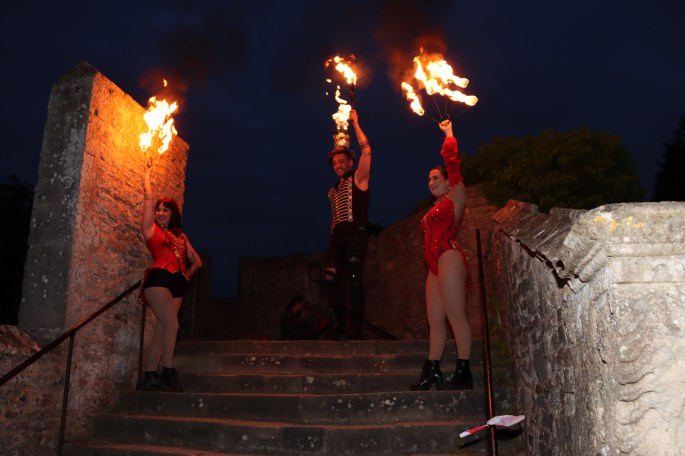 The lit beacon with Fire performers from Wookey Hole Circus