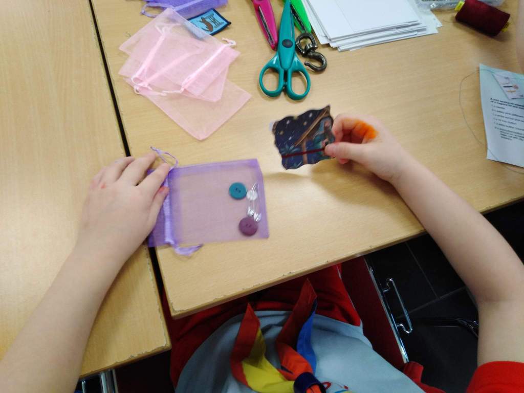 Photo showing a Rainbow assembling a sewing kit