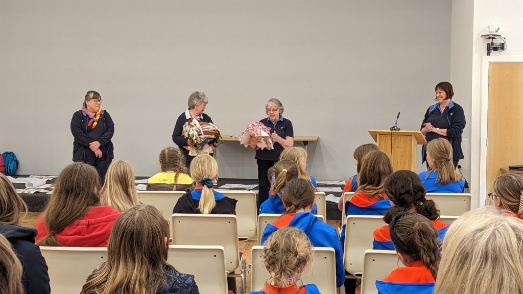 Photo of leaders congratulating the girls after a fun day of activities