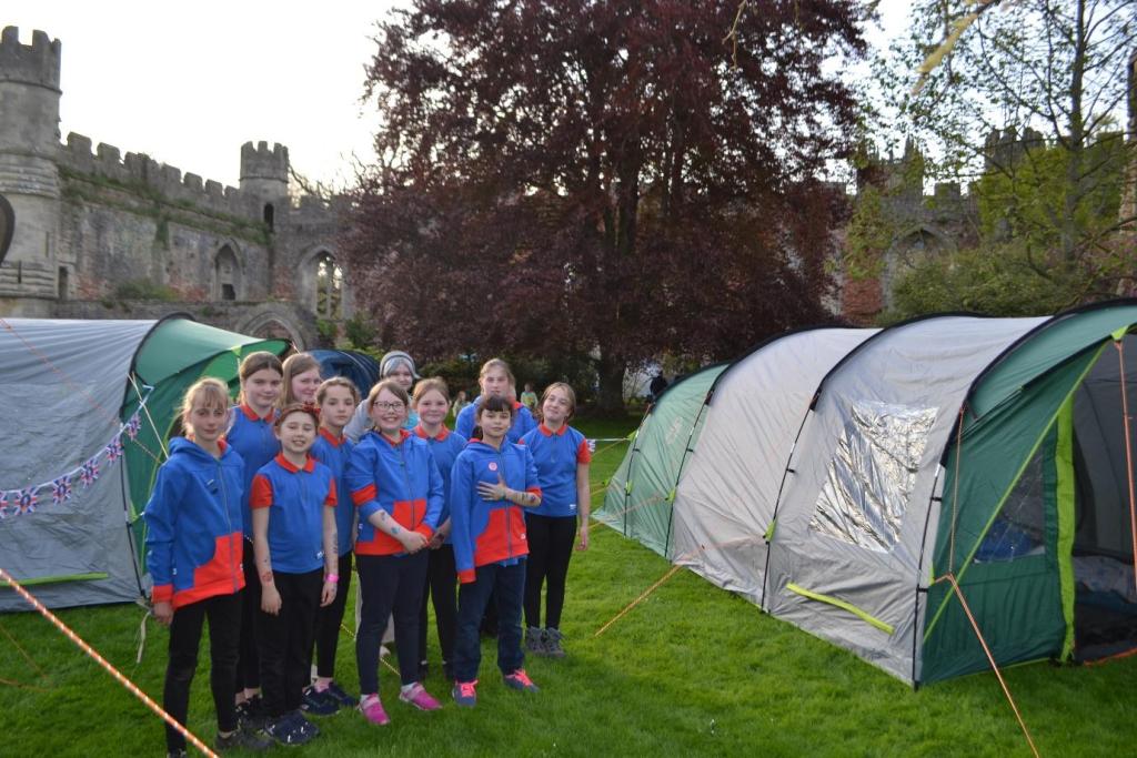Guides standing outside their tents at the Bishops Palace gardens, Wells