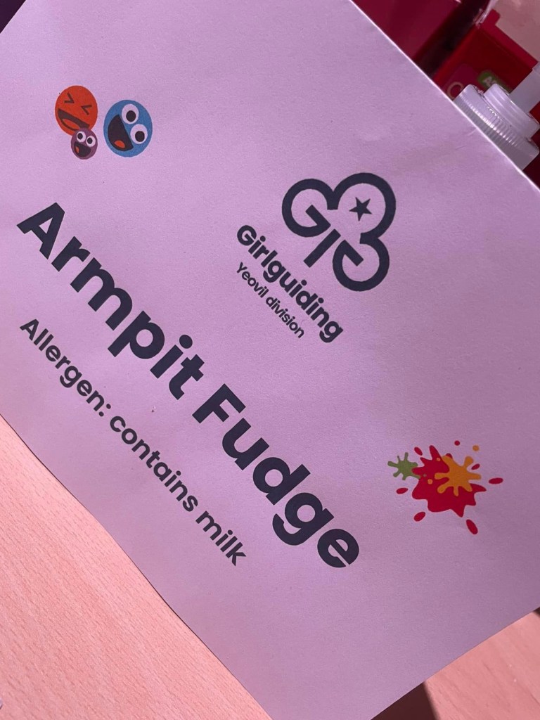 Photo of the 'Armpit Fudge' sign with the Girlguiding Yeovil logo