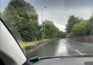 A rainy view through a car windscreen on the journey