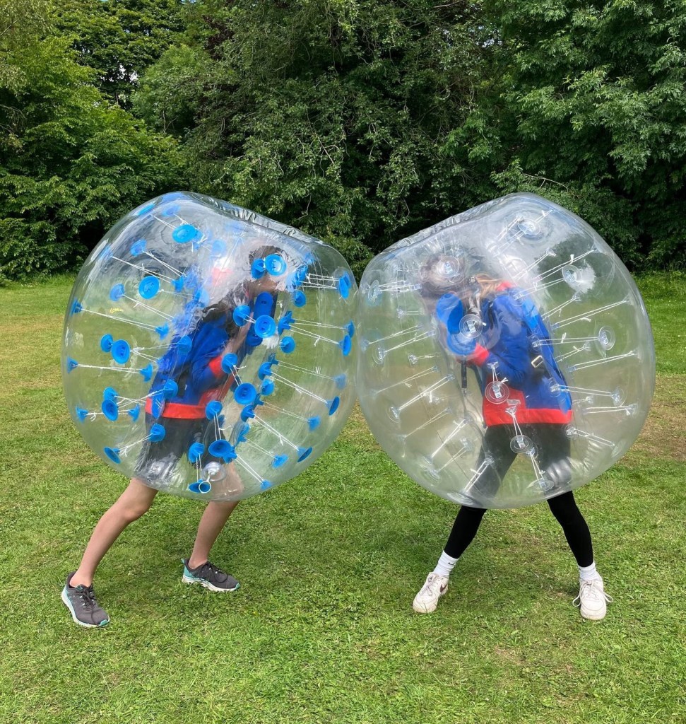 2 girl guides have fun in Zorbs