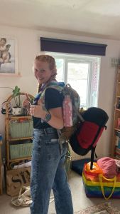 Alura Rose in Girlguiding uniform with a backpack ready for an adventure