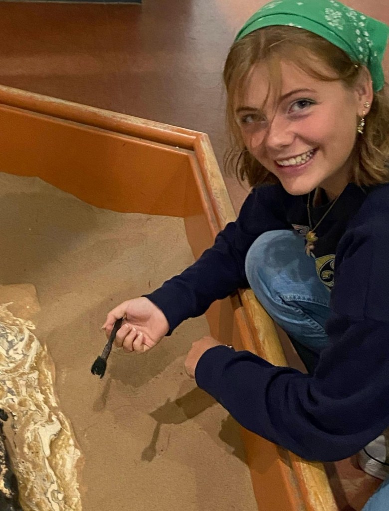 Courtney uncovers dinosaur bones