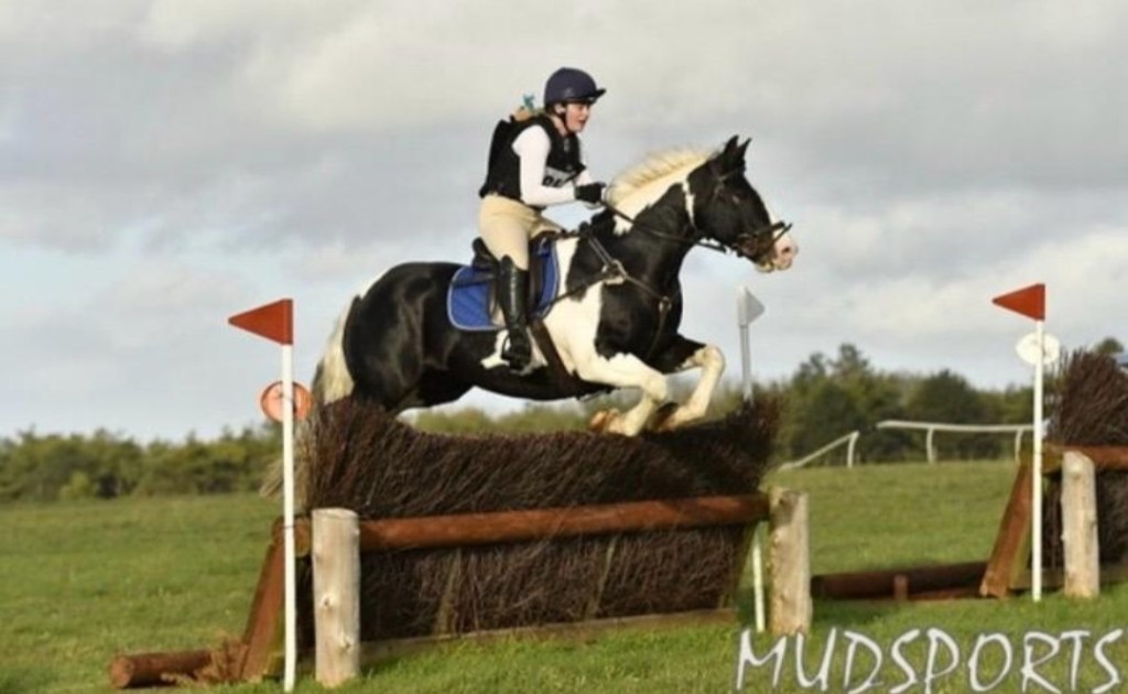 Courtney jumping with her horse
