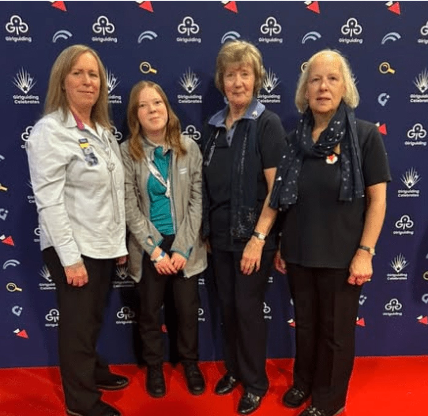 Four Girlguiding volunteers on the red carpet at Girlguiding Celebrates