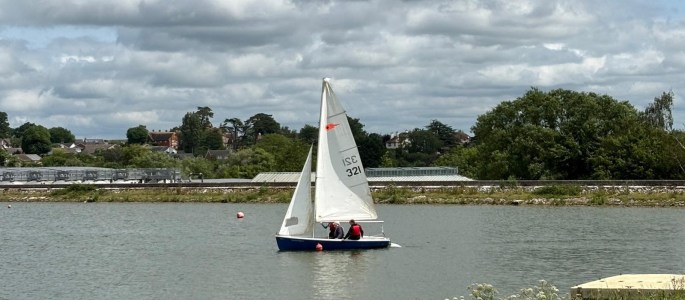 Our Girlguiding Somerset sailing dinghy, a comet trio, out on the water at Durleigh Sailing Centre