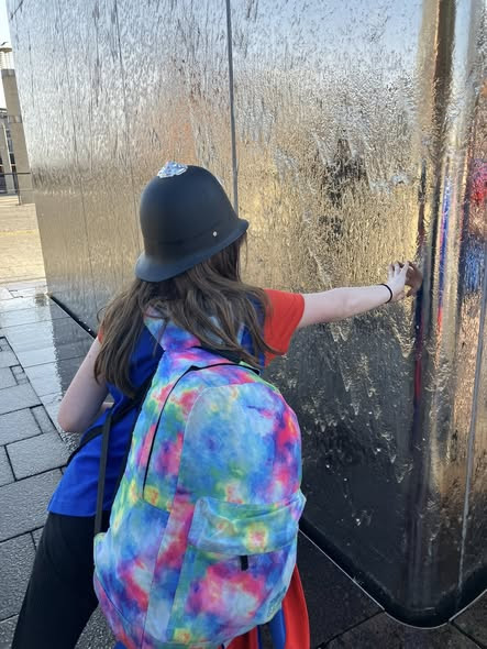 A Guide wears a police helmet on the Cityscape Adventure